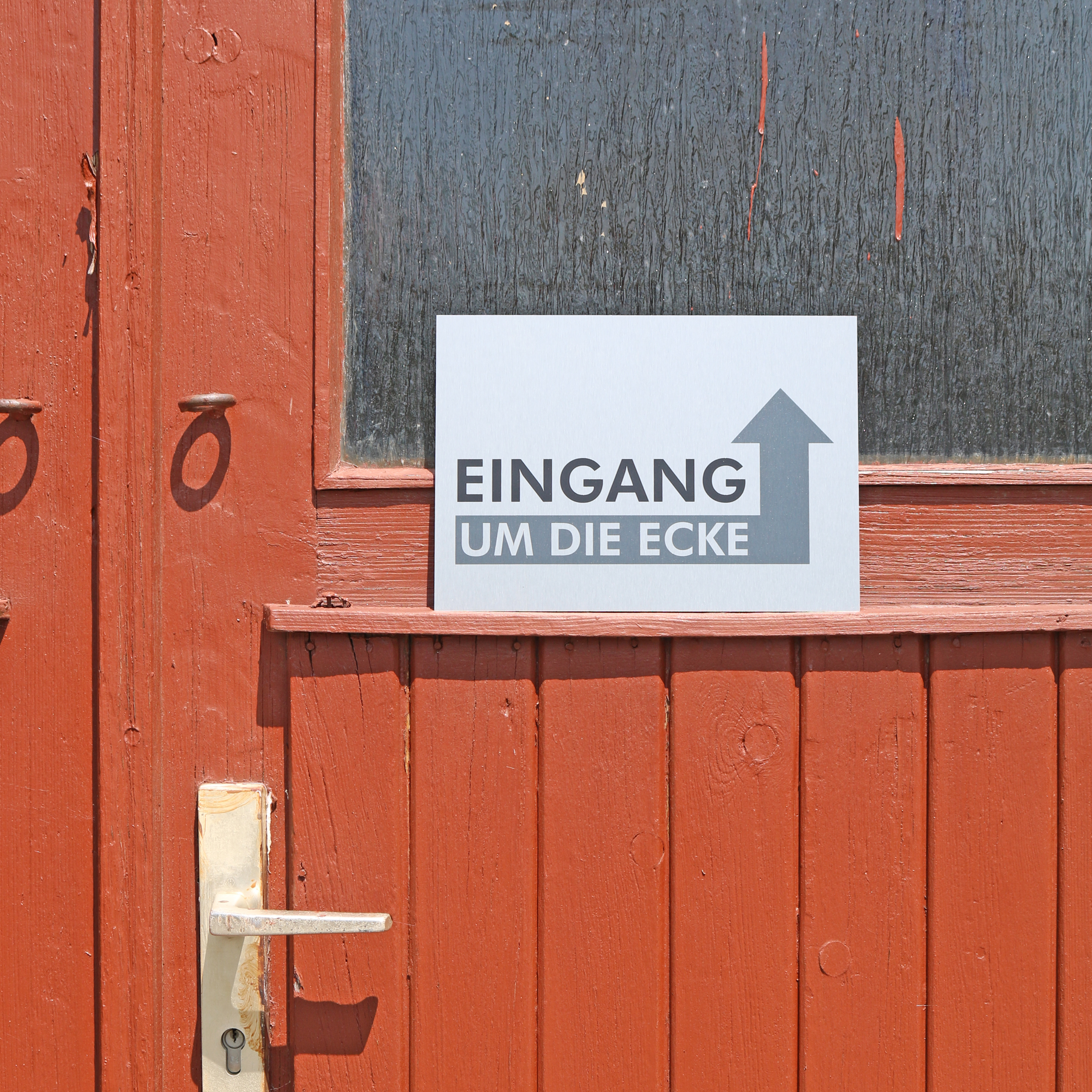 Hinweisschild "Eingang um die Ecke" mit Pfeil - A4